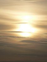 Sonnenuntergang durch Wolkenschleier